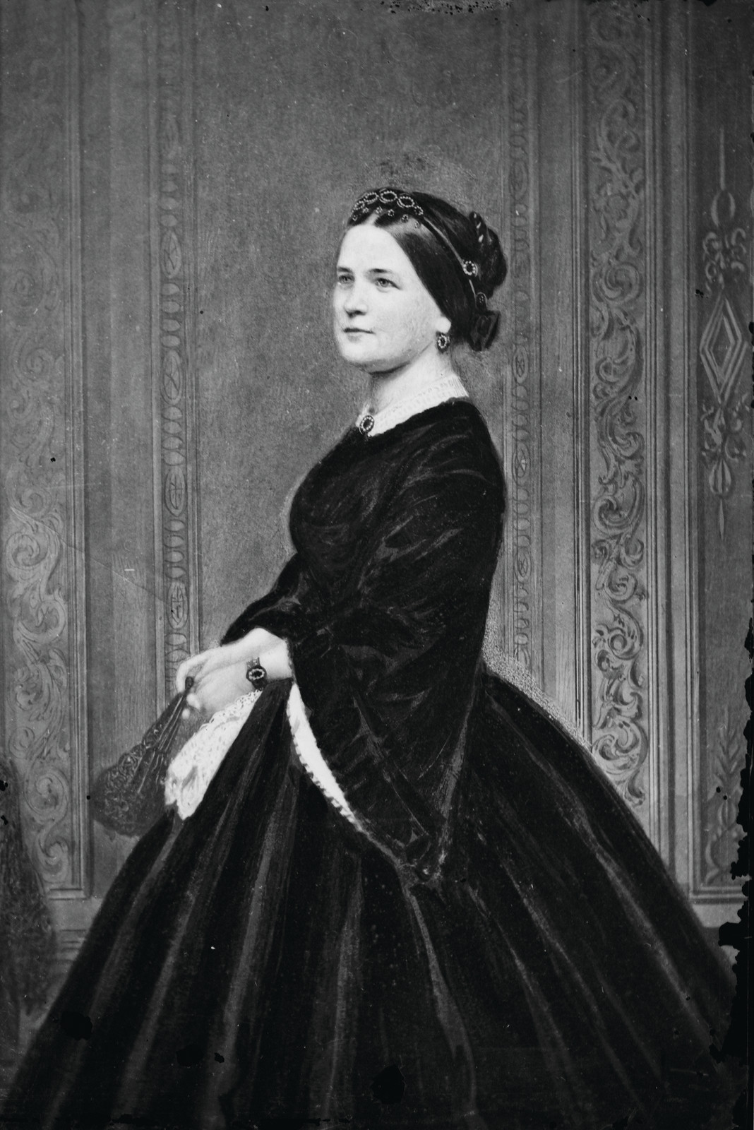 Portrait of a woman in a dark velvet dress — historic image