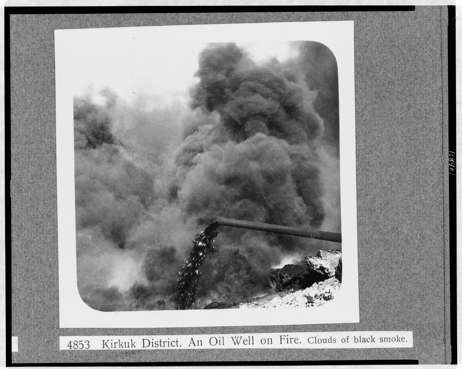 Kirkuk district--An oil well on fire--Clouds of black smoke, [1932 or 1933] — historic photograph