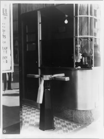 Turnstile and ticket booth of Trans-Lux Theatre, 58th St. and Madison Ave., New York City
