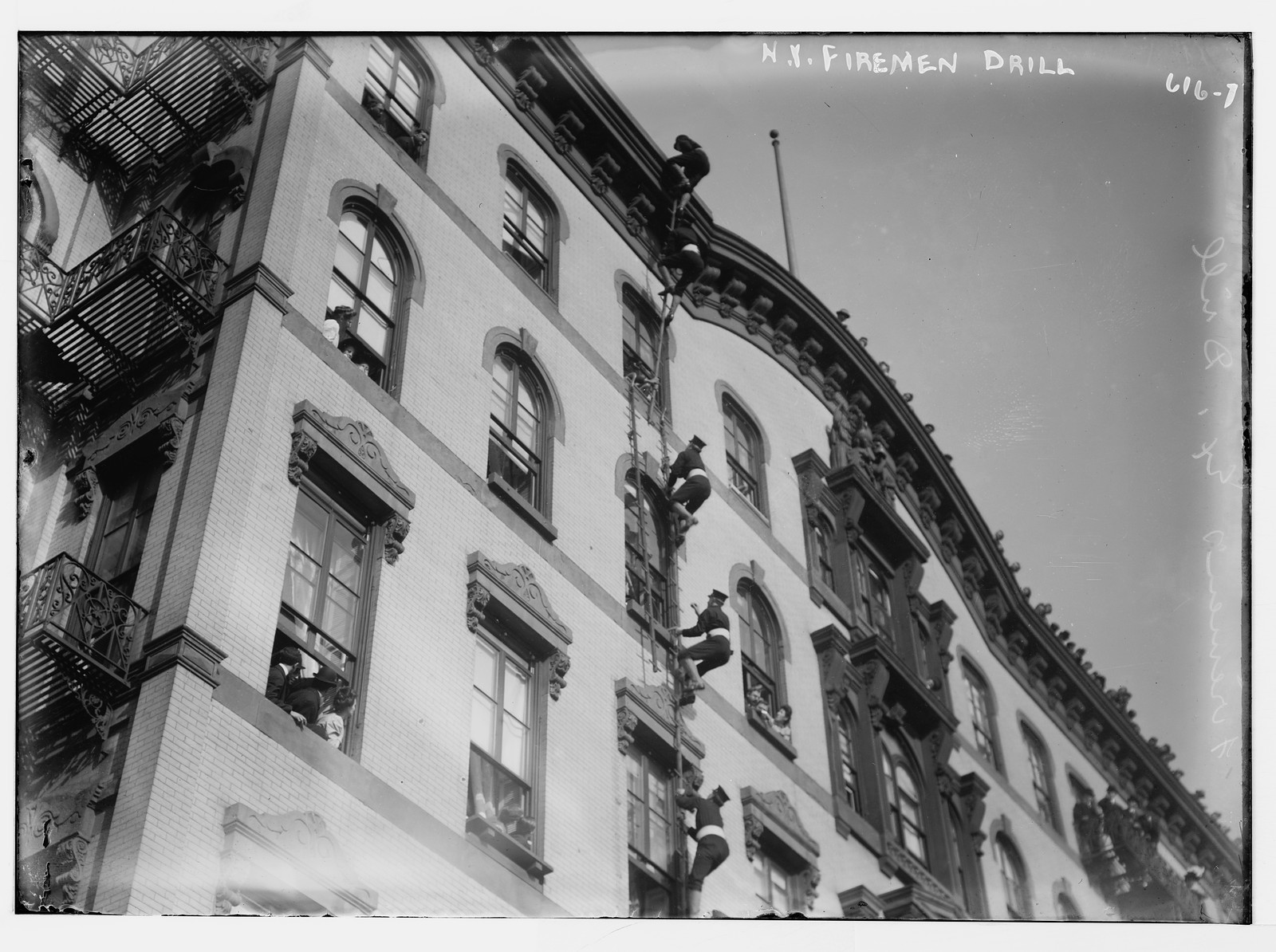 N.Y. Fireman drill, climbing up side of bldg, New York, n/a — historic photograph