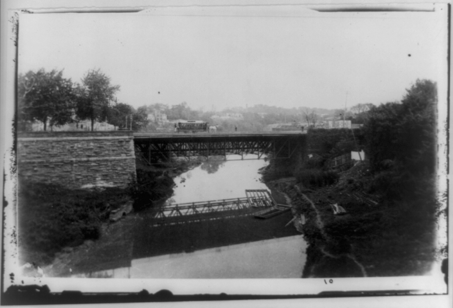 [Bird's-eye view of horse-drawn streetcar on M Street Bridge over Rock Creek], [between 1870 and 1920] — historic photograph