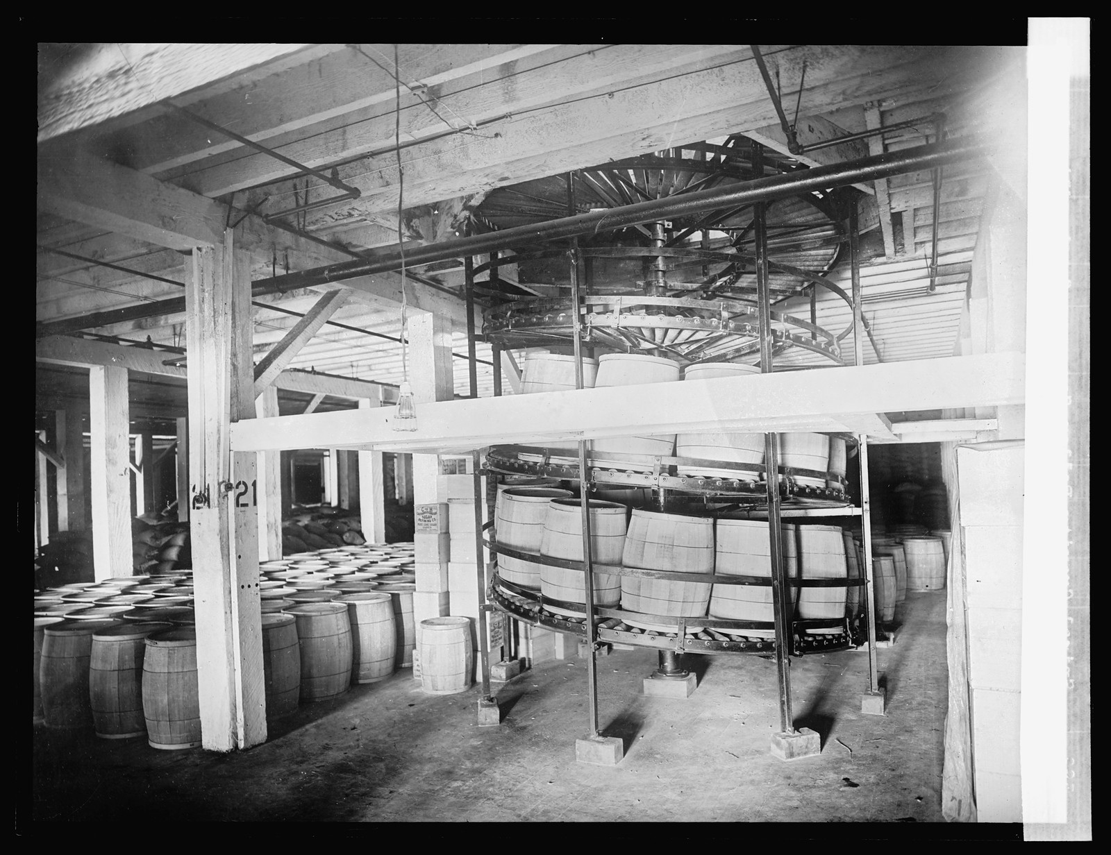 Spiral gravity boiler conveyor for handling barrels and boxes, [between 1910 and 1920] — historic photograph