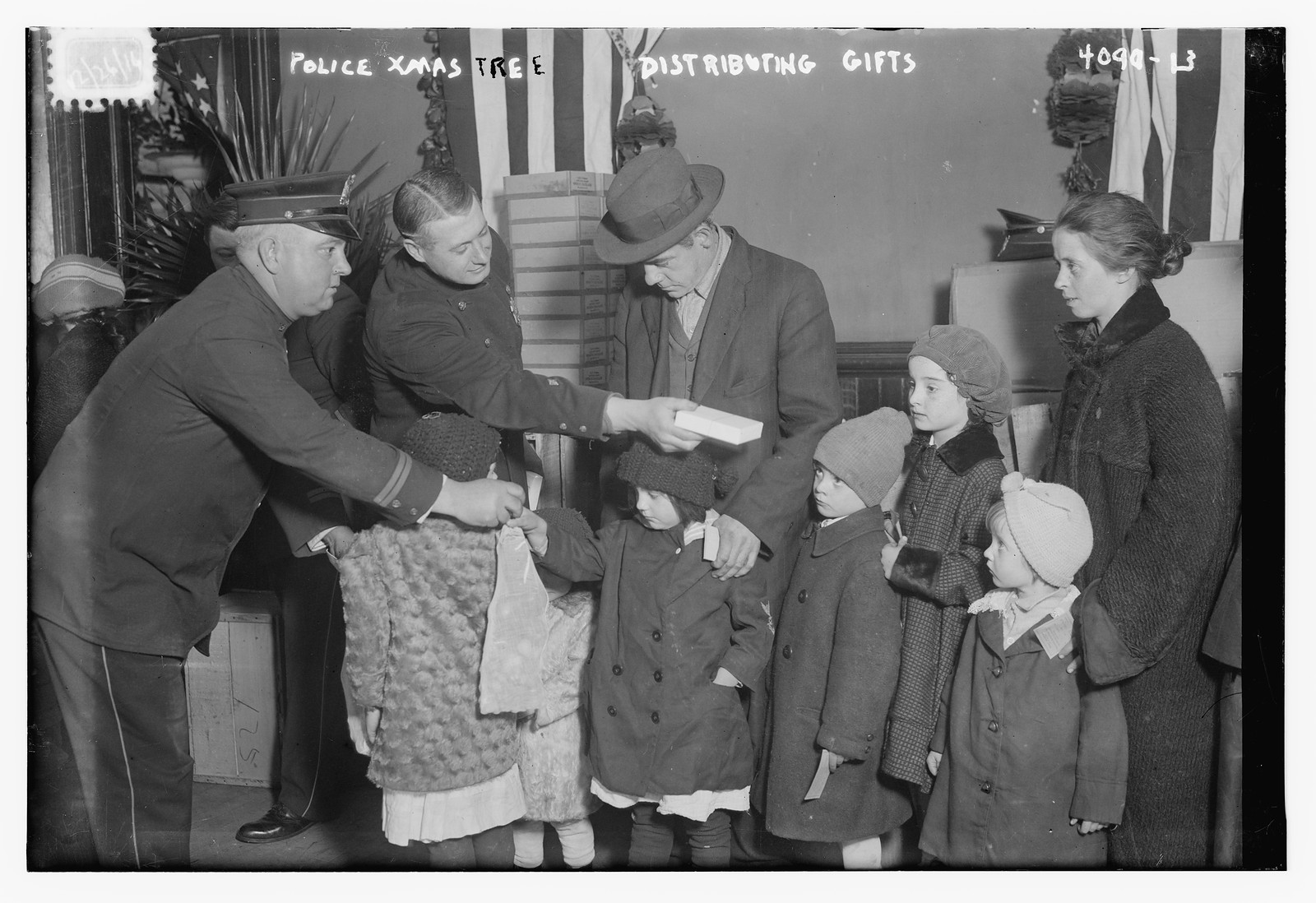 Police Xmas tree -- distributing gifts, n/a — historic photograph