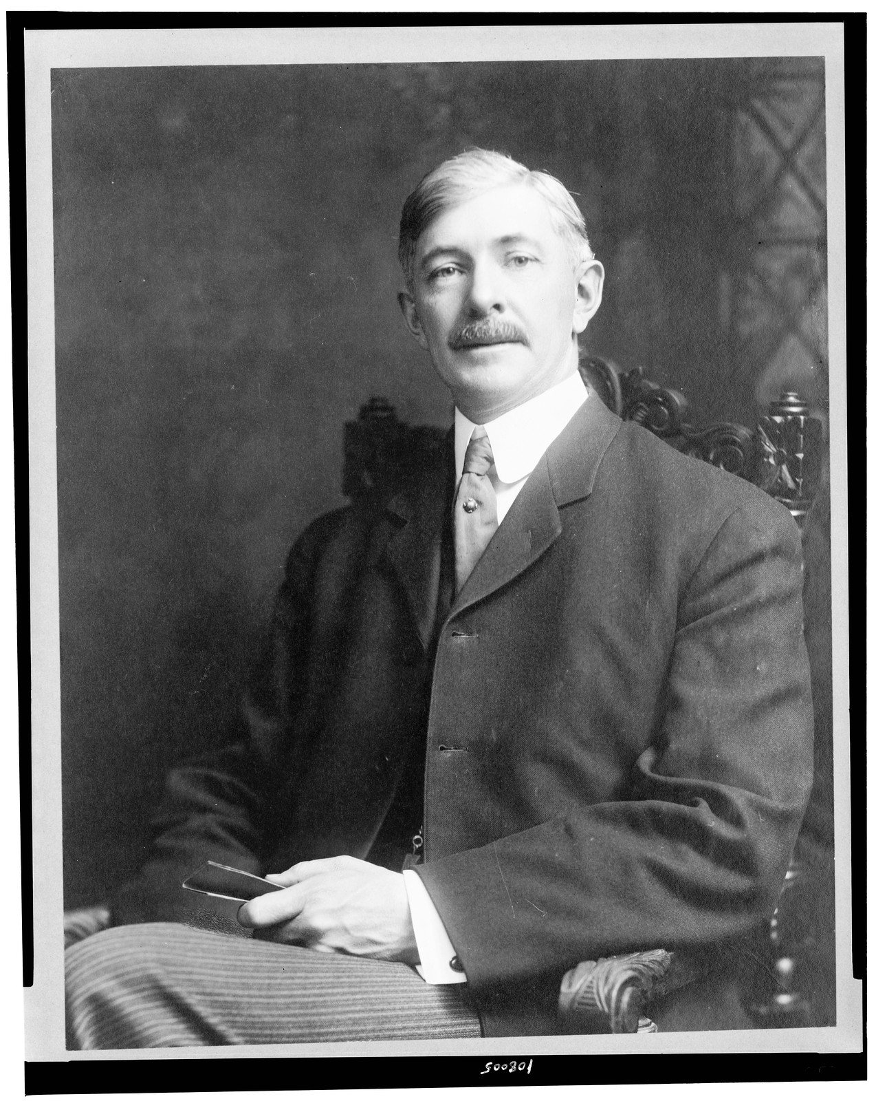 [Dr. Albert Shaw, three-quarter length portrait, seated, facing slightly left], c1907. — historic photograph