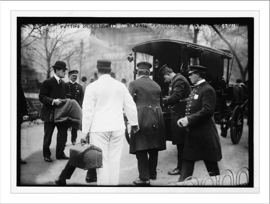 Policeman put Silverstein in horse-drawn ambulance at anarchist riot, Union Square, New York, 3/28/08. — historic photograph