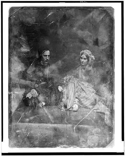 Seated man and woman in Eastern dress with hookah