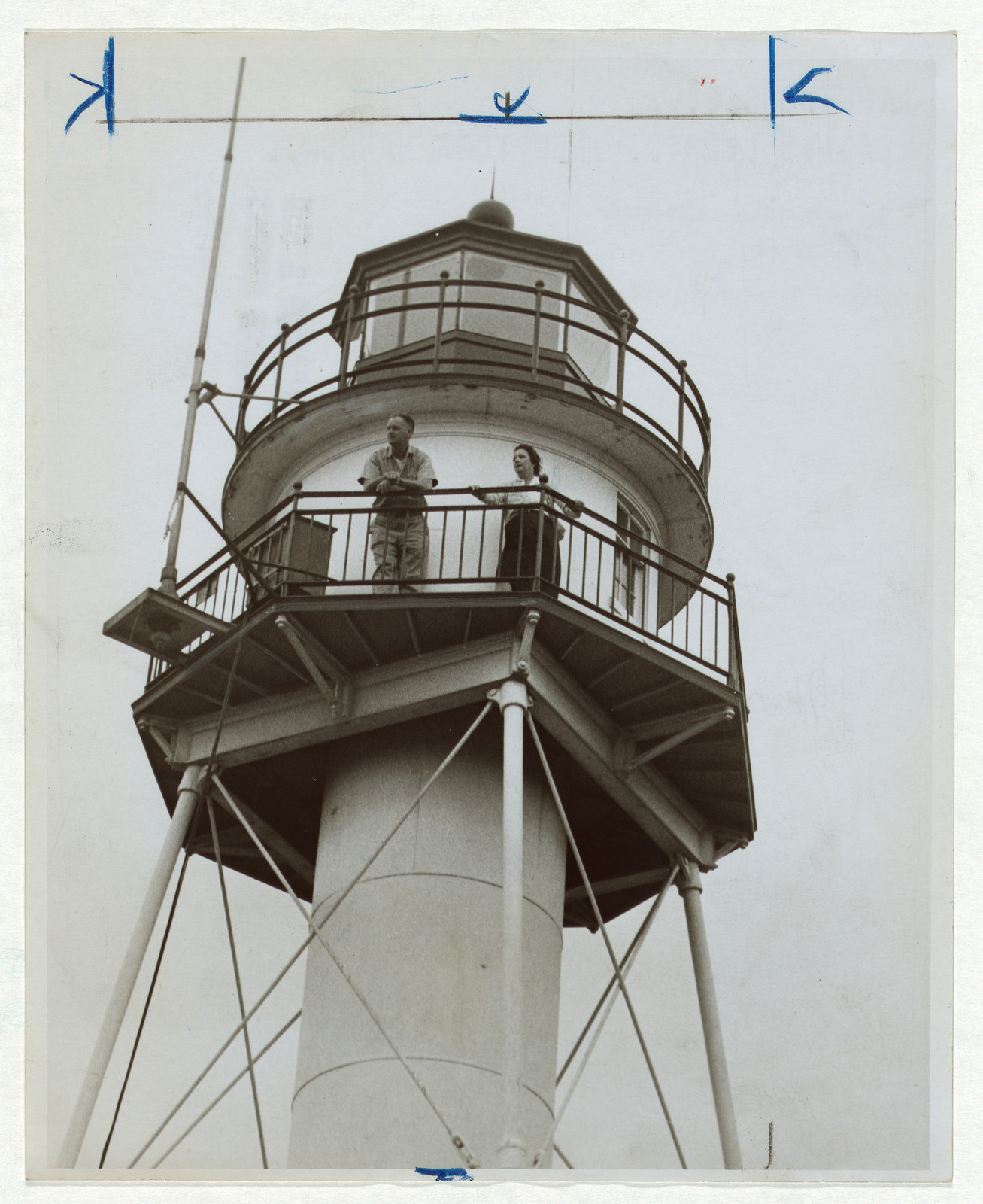 Two people on a lighthouse gallery, black and white photograph — historic photograph