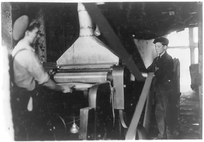 Boy at planing machine, Ind[iana] Mfg. Co. Location: Peru, Indiana.