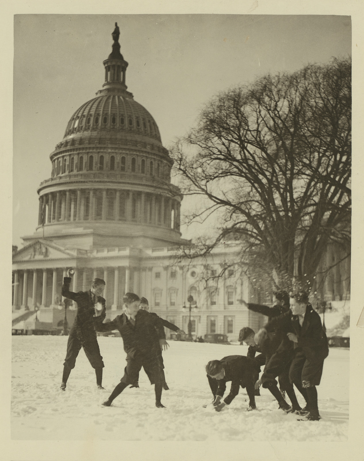Senate Page Boys Stage Their First Snow Battle on the Capitol Plaza [c. 1909–1932].(photographic print, gelatin silver), c. 1909–1932 — historic photograph