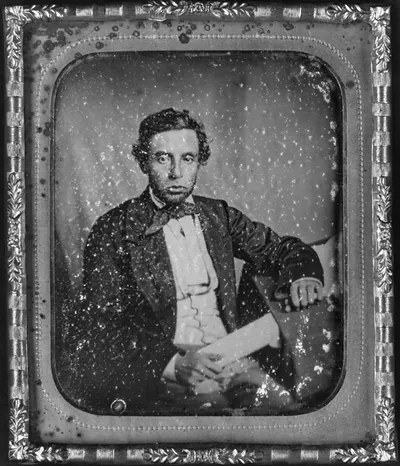 [Alfred Francis Russell, three-quarter length portrait, full face, seated at desk]