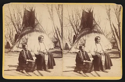 Two Native people seated before a tipi, stereograph
