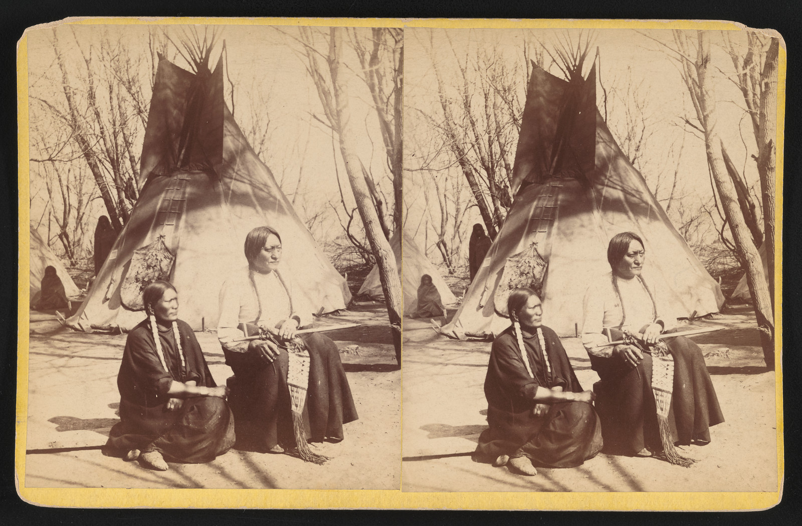 Two Native people seated before a tipi, stereograph — stereograph