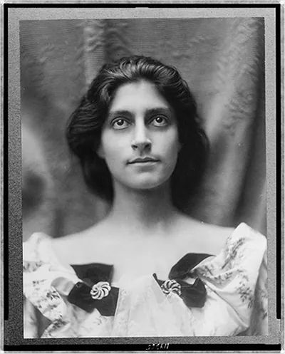 [Portrait of a woman in a floral dress adorned with diamond brooches and bows]