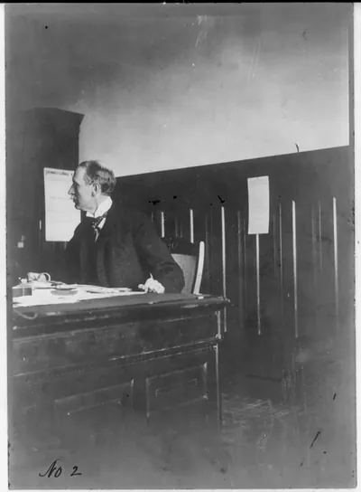 [Perry Sanford Heath, 1857-1927, half-length portrait, seated at desk]