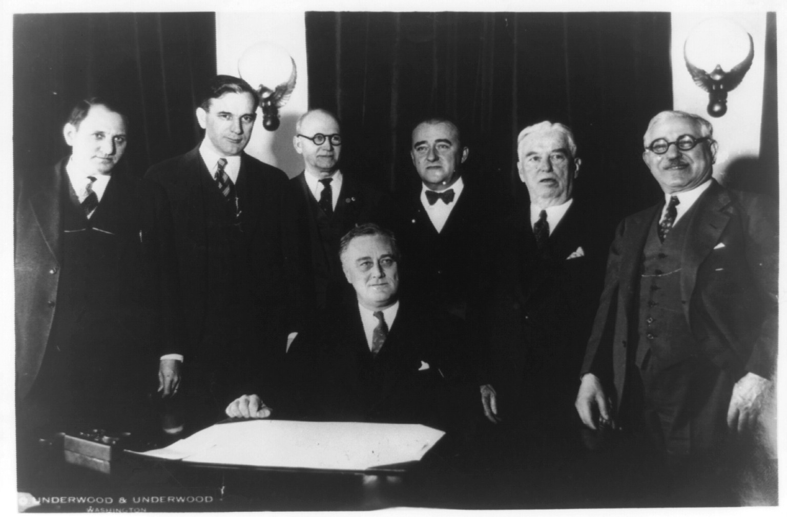 [President Franklin Roosevelt and six other men in cabinet room], [between 1933 and 1945] — historic photograph