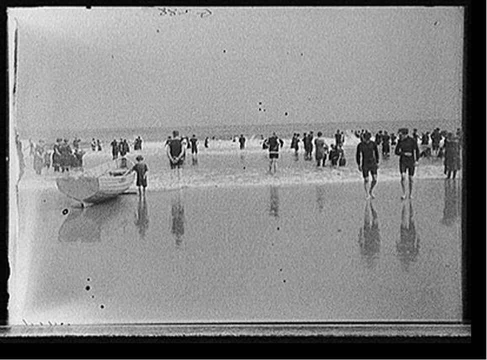 [Boat on beach and bathers, Atlantic City, N.J.], [between 1900 and 1915] — historic photograph