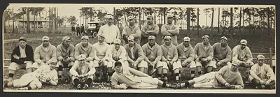 Baseball team panorama, players seated and standing in sweaters