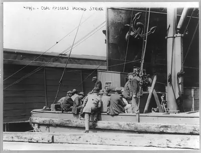 [Striking seamen: Coal passers talking strike on boat, 14 June 1911]