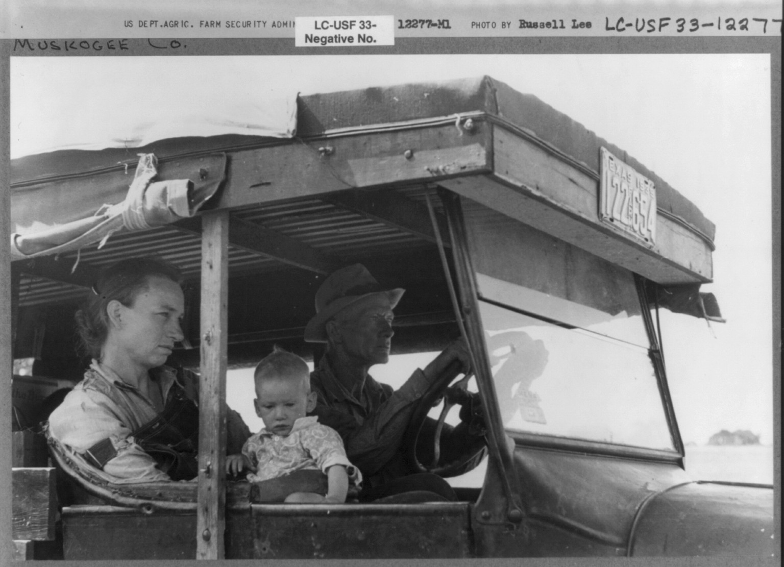 White migrant family in their automobile east of Fort Gibson, Muskogee County, Oklahoma, 1939 June. — historic photograph