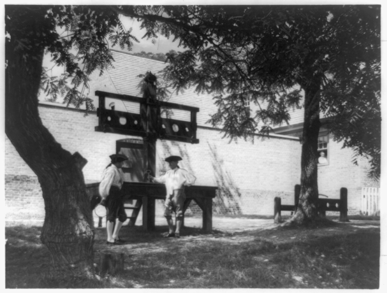 [Stocks and pillory outside the restored public gaol, Williamsburg, Virginia], [ca. 1937] — historic photograph