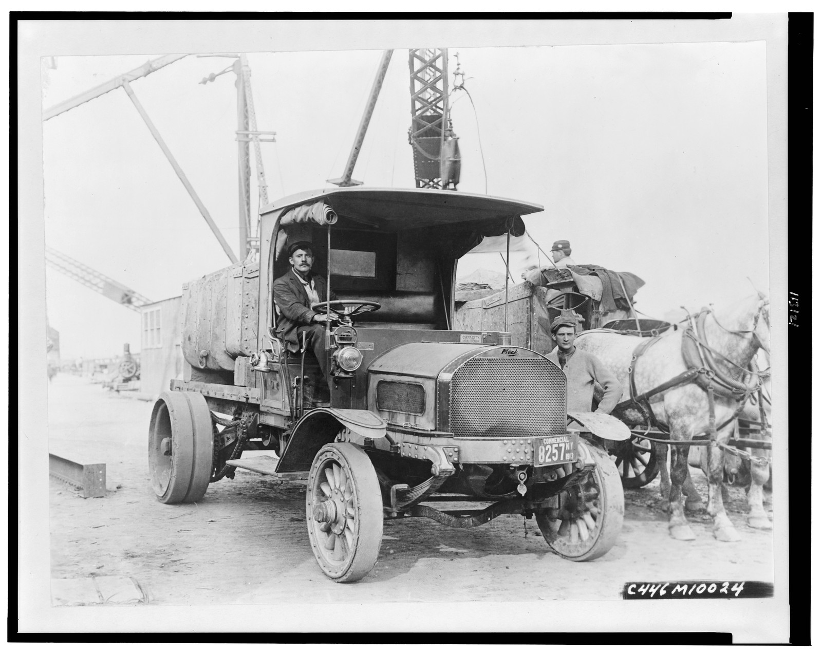 [Mack truck, workers, and horses at a construction site in New York State], 1913 — historic photograph