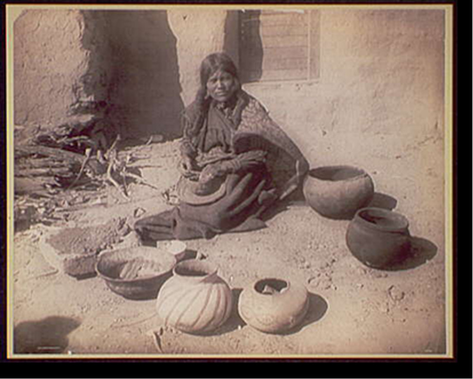 Hopi woman making pottery, c1910. — historic photograph
