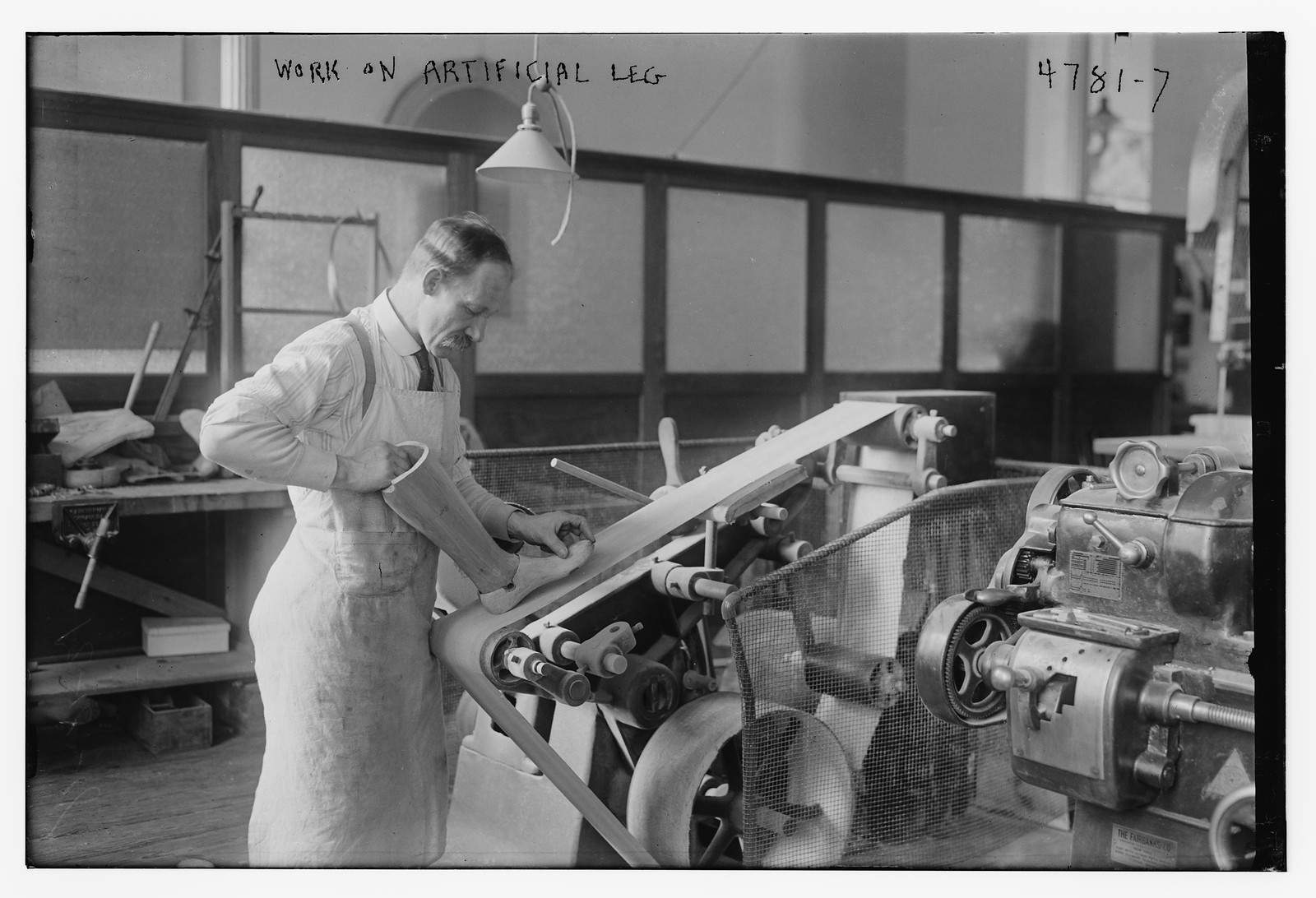 Work on artificial leg, n/a — historic photograph