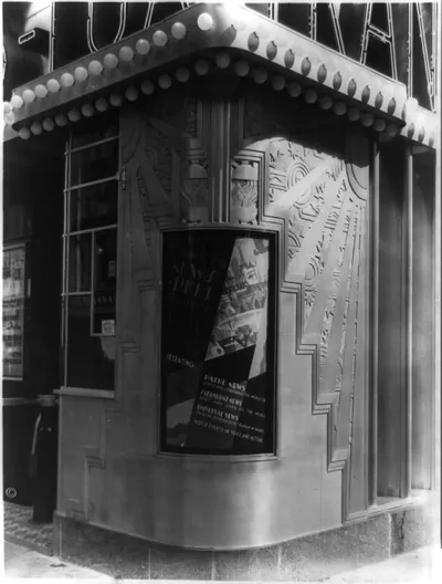 [Inset billboard at corner of Trans-lux Theatre, 58th St., and Madison Ave., New York City]