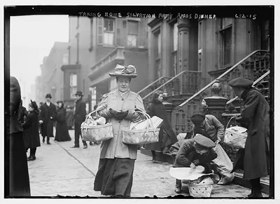 Women carrying baskets - Salvation Army Christmas dinner, New York