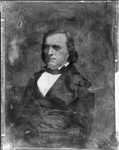 Half-length portrait of a man in dark coat and cravat