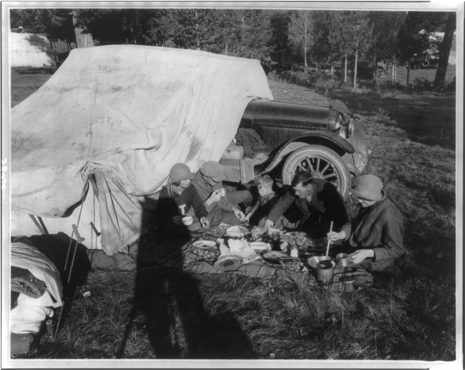 Tower Falls public auto camp party - probably in or near Yellowstone Park — historic photograph