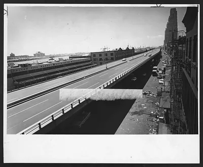 Elevated highway beside Fulton Fish Market building, black and white photograph