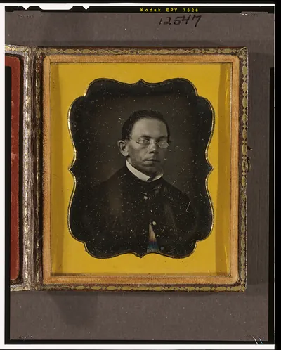 [Minister wearing spectacles]