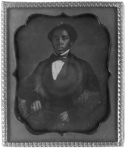 [Unidentified man, three-quarter length portrait, full face, with arm on table with tablecloth]