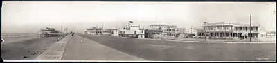 Panoramic photograph of a beach boulevard with hotel buildings