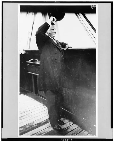 [Theodore Roosevelt saluting from bridge of Kaiserin Auguste Victoria, June 20, 1910]