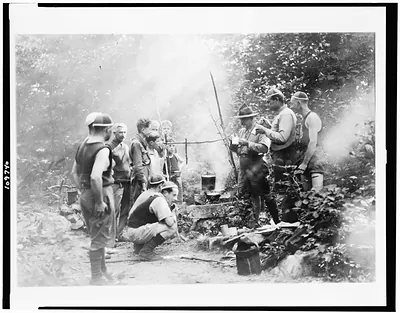[Boy Scouts cooking over open fire at Camp Ranachqua]