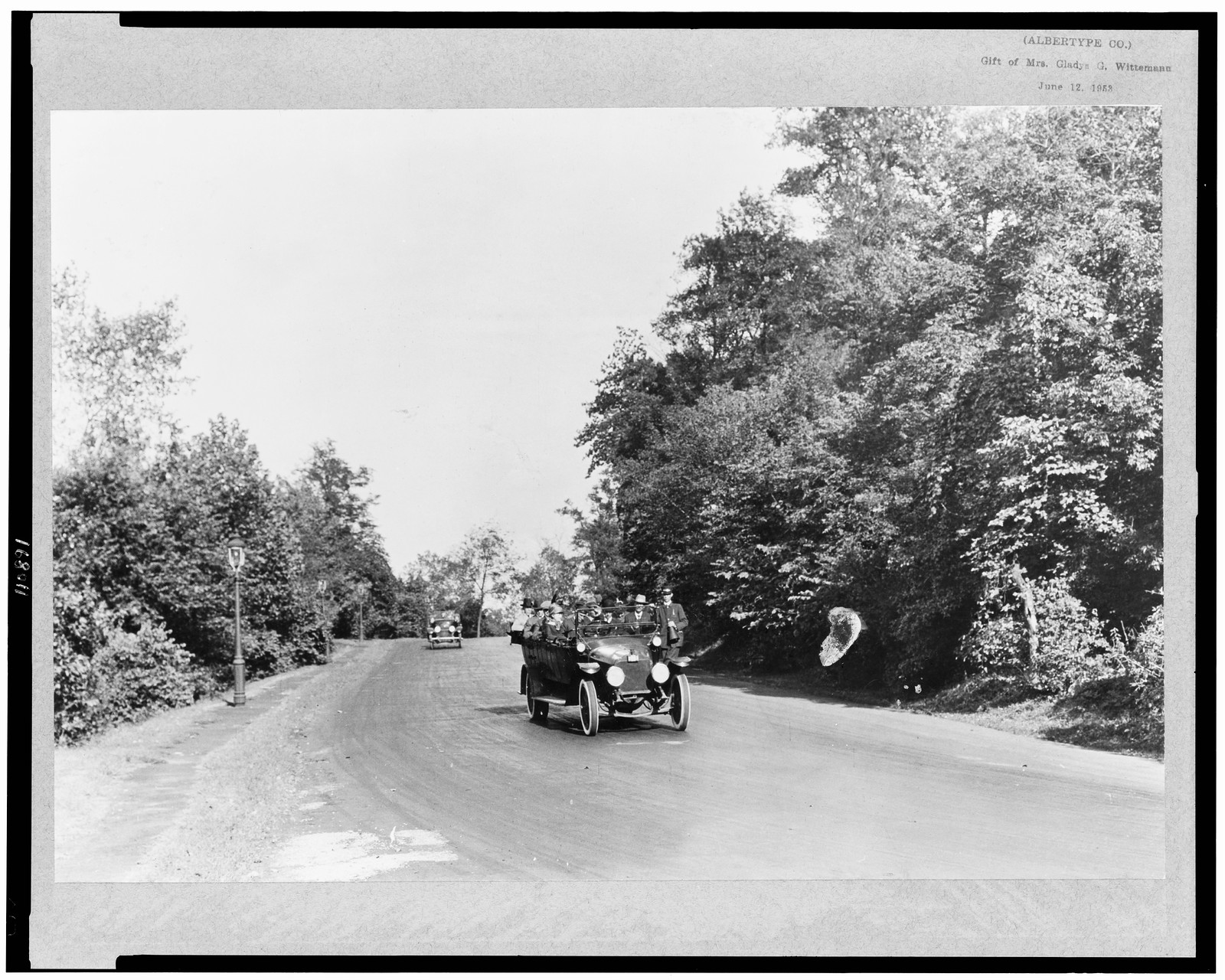 [Early model automobiles on highway, Kansas City, Missouri], [192-(?)] — historic photograph