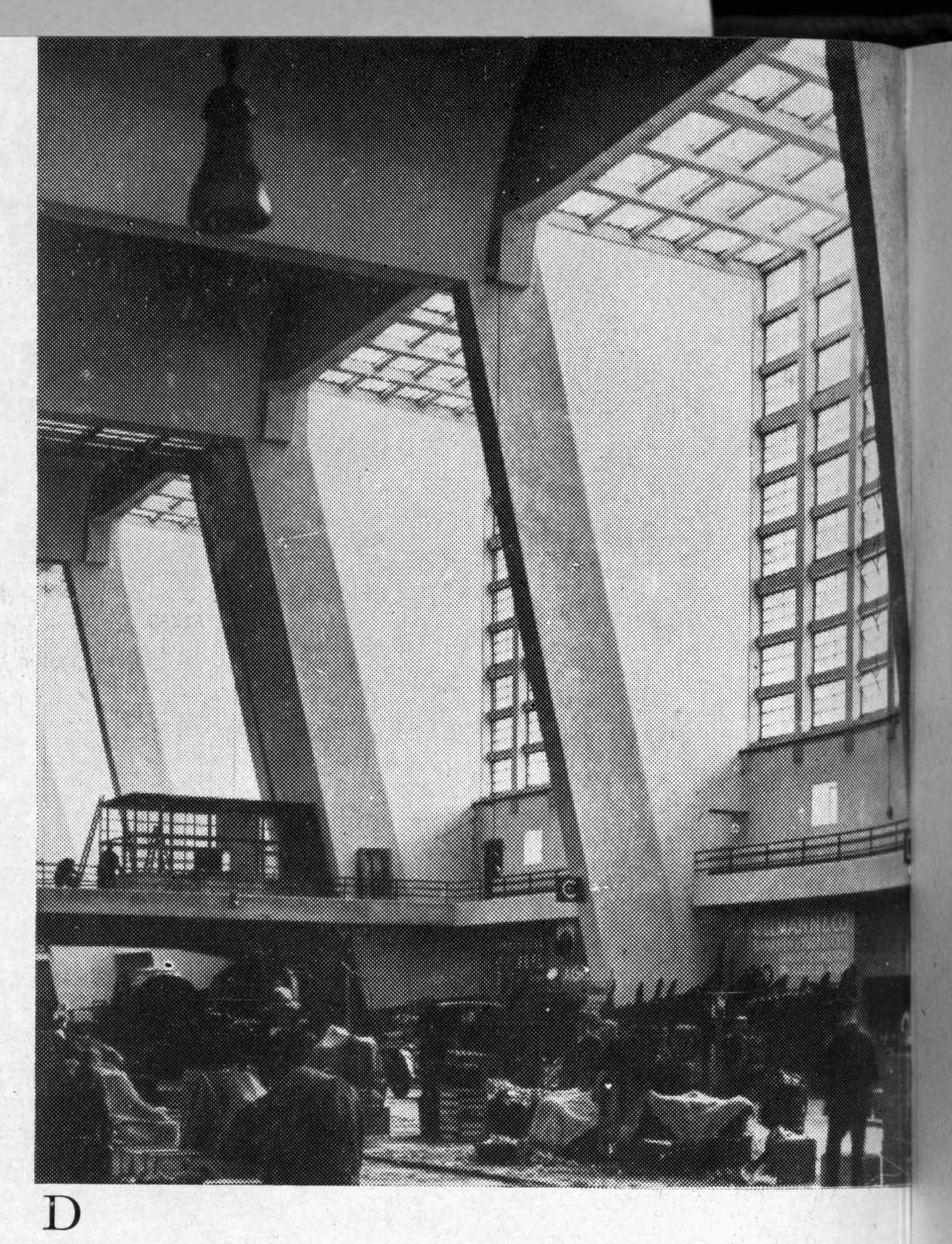 Interior of a modern hall with glazed roof and concrete arches — historic image
