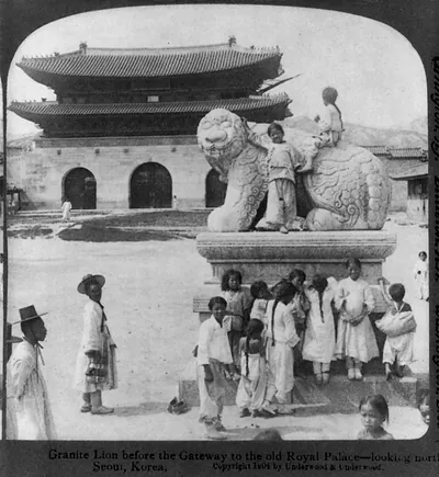 Granite lion before the gateway to the old Royal Palace - looking north - Seoul, Korea