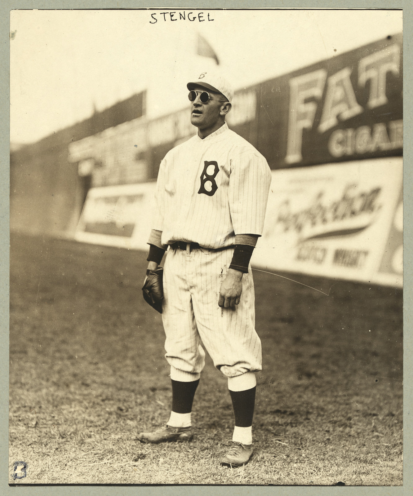 [Casey Stengel, full-length portrait, standing, facing left, wearing sunglasses, while playing outfield for the Brooklyn Dodgers], [ca. 1915] — historic photograph