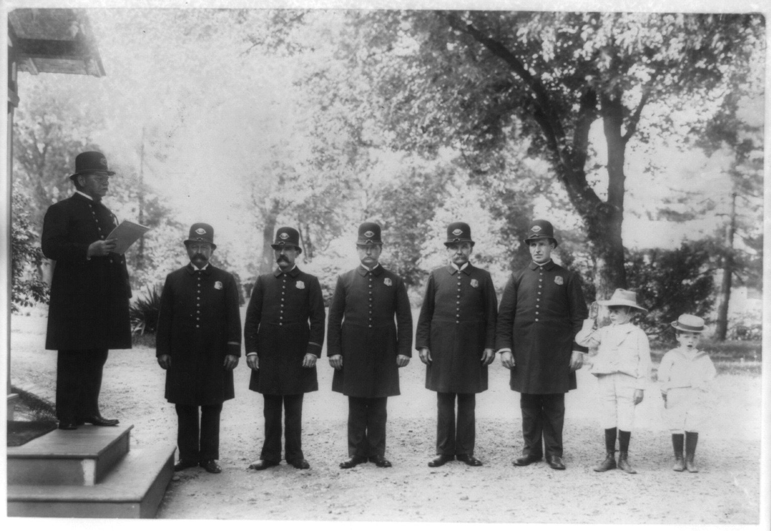 Archie and Quentin Roosevelt with White House policemen, c1902 June 17. — historic photograph