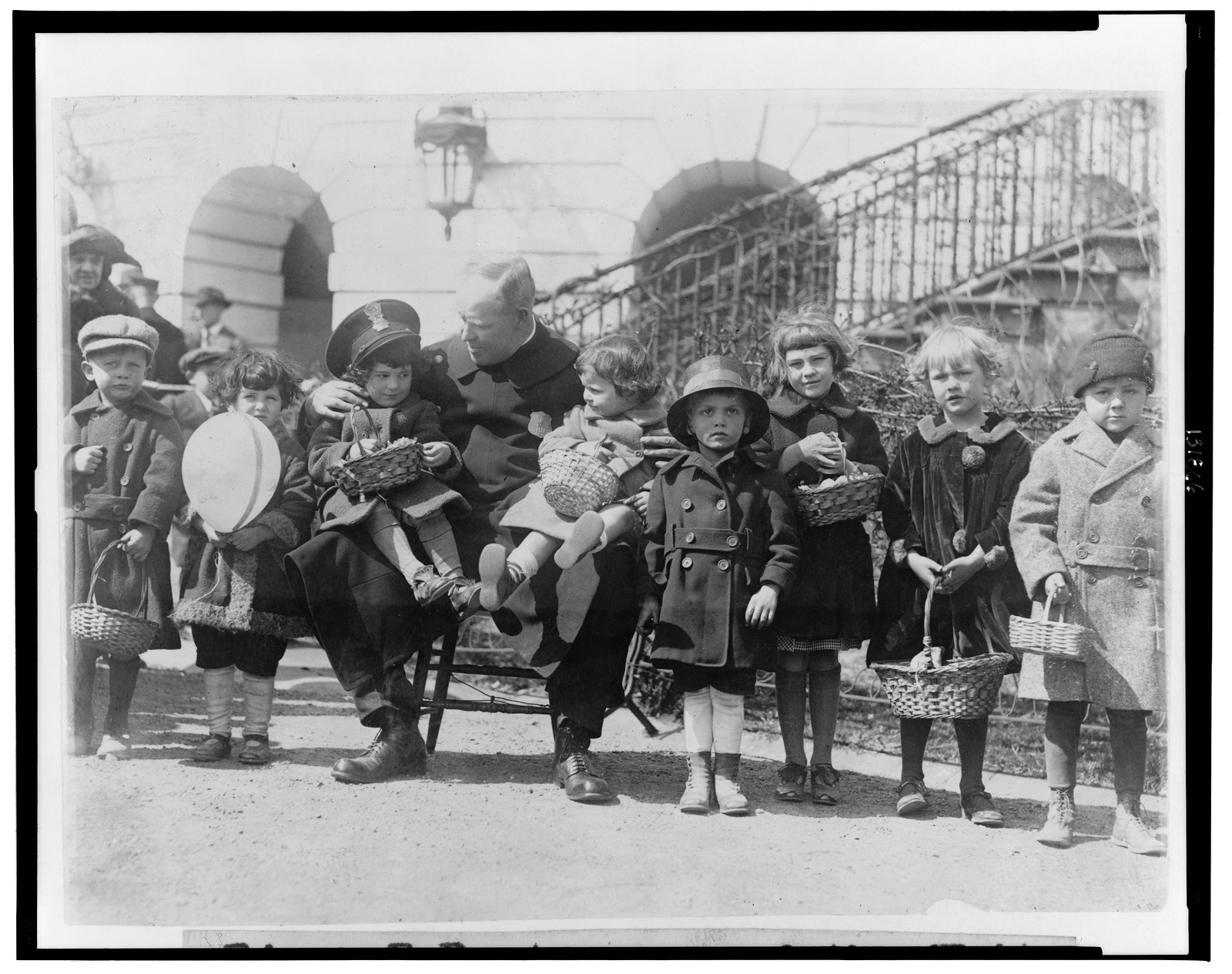 Edgar E. Porter, one of the White House policeman, was detailed to care for the lost and strayed children during the Easter egg rolling at the White House today, 1923 April 2. — historic photograph