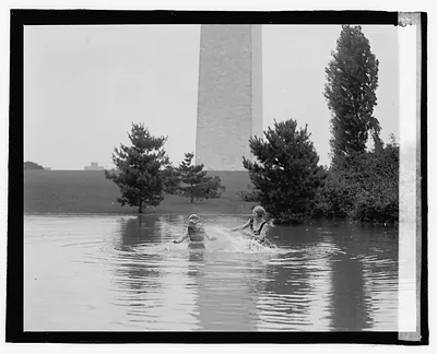 [Swimmers; Washington Monument in background]