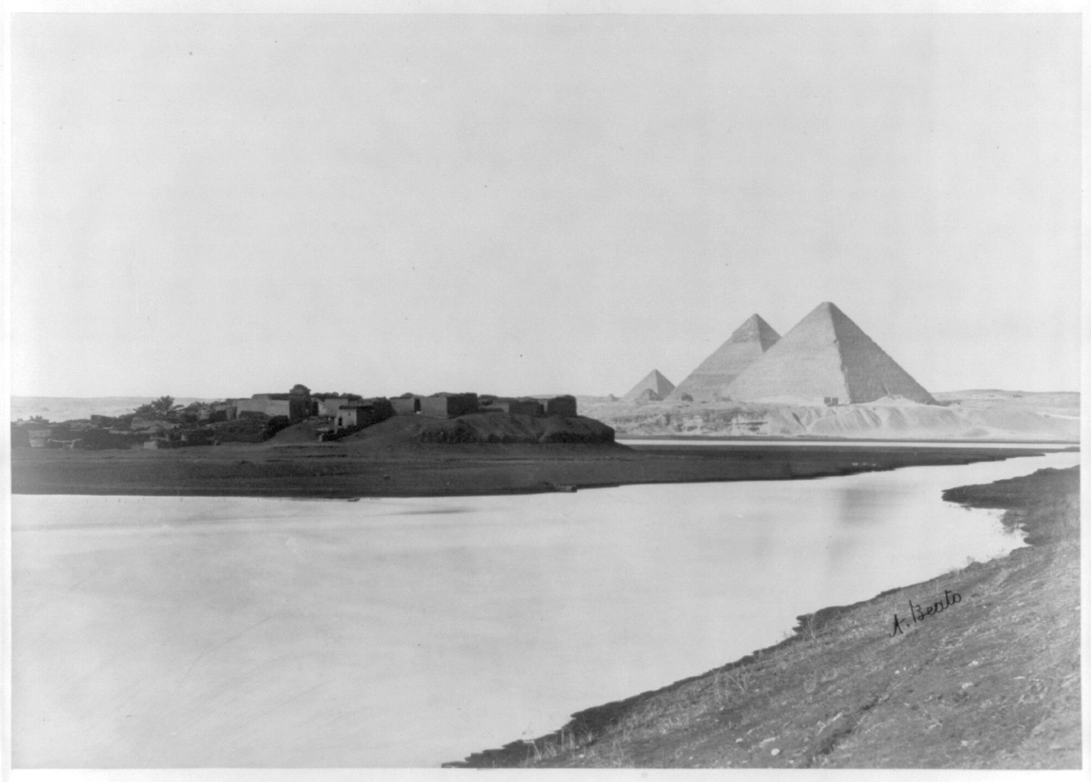 [Three pyramids of Giza, Egypt, with village in foreground], [ca. 188-] — historic photograph