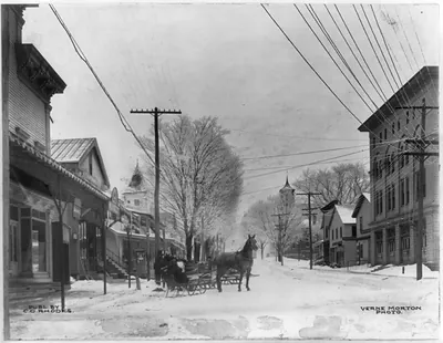 Horses and sleighs on snow covered Cortland Street, looking east, Groton, N.Y.