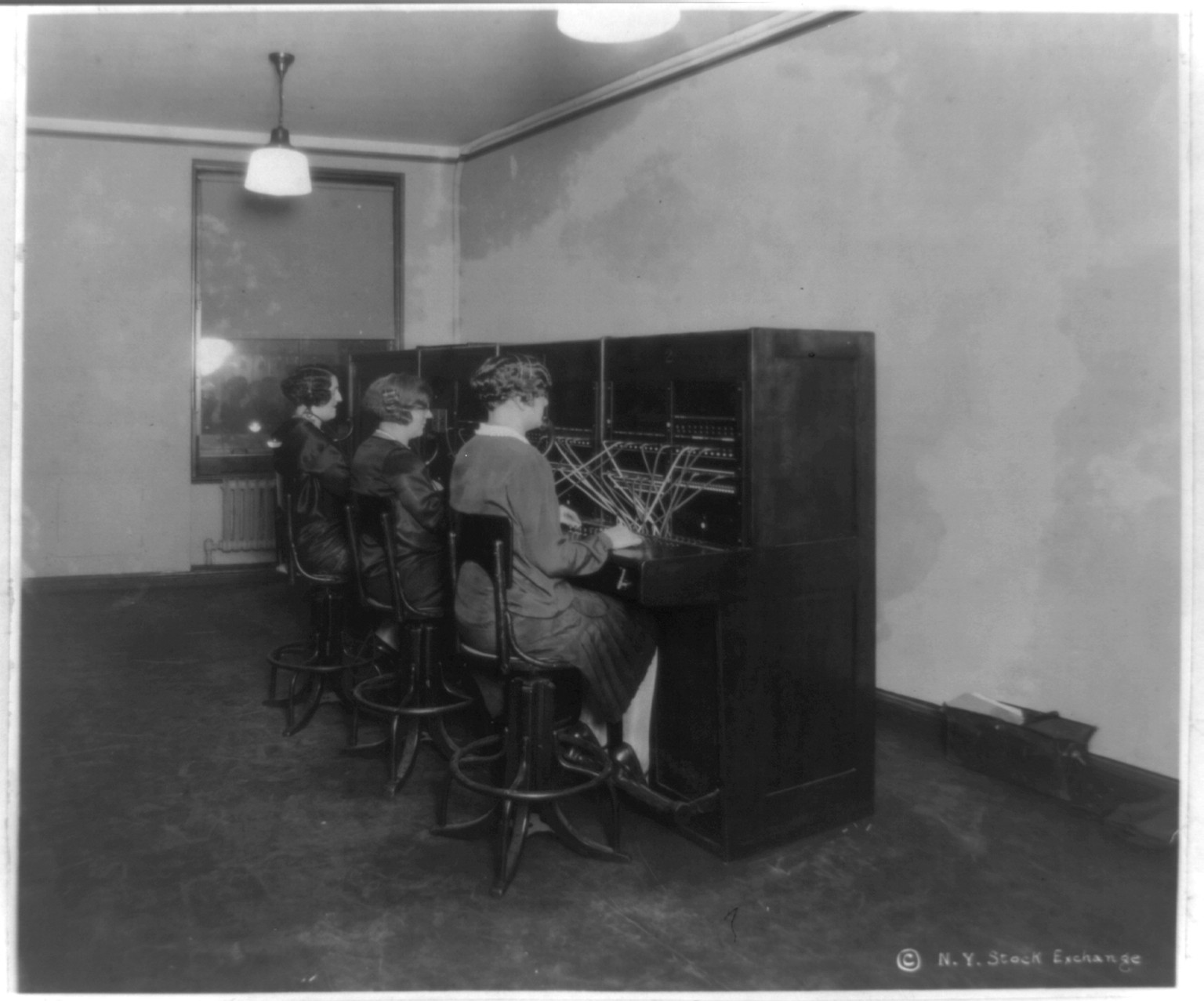 Telephone operators - New Quotation Room - New York Stock Exchange, c1928. — historic photograph