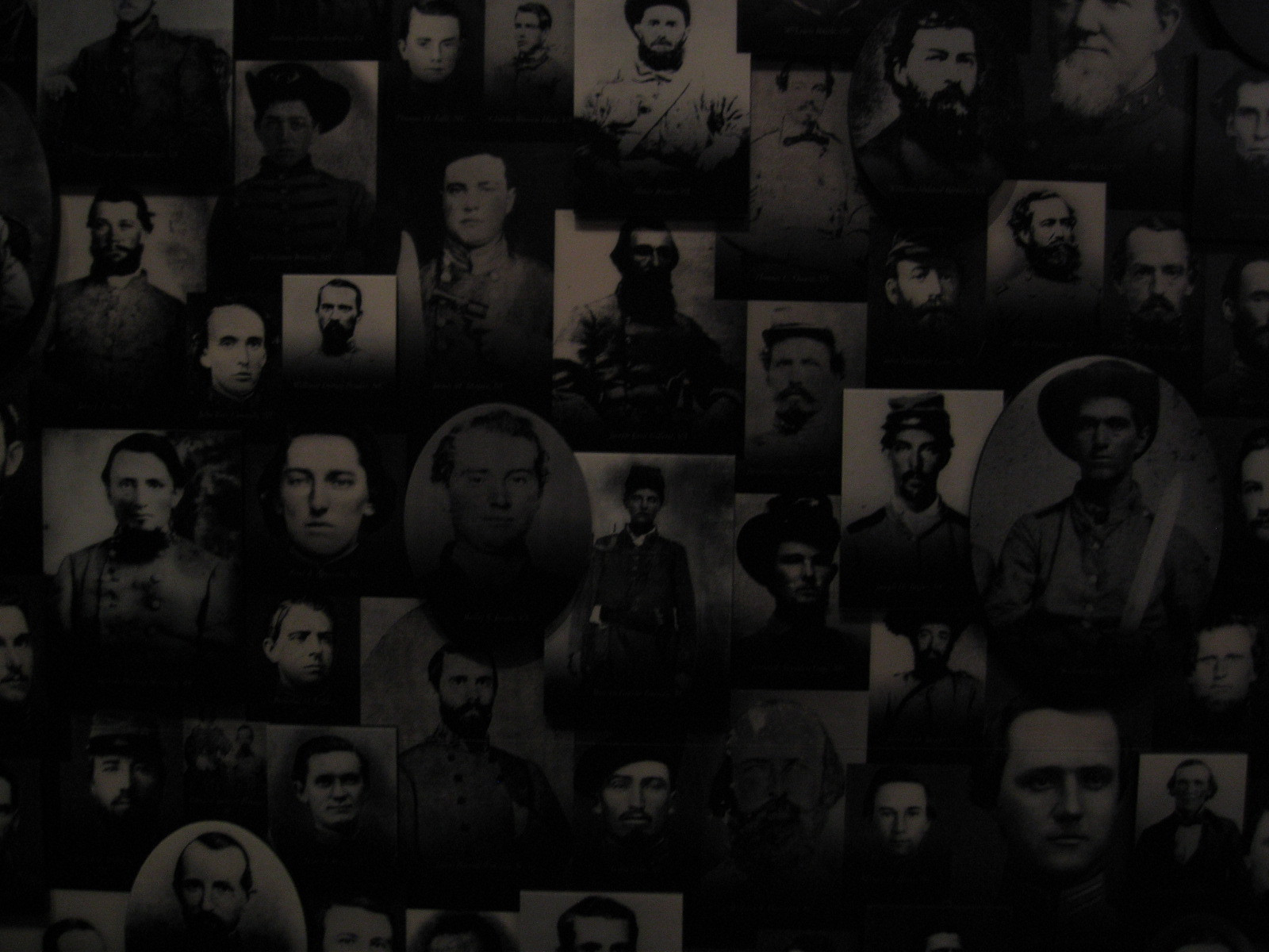 Wall of 19th-century soldier portrait photographs — historic photograph