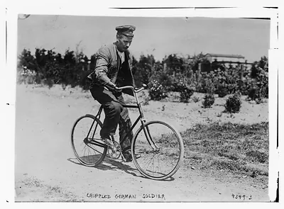 Crippled German soldier on bike