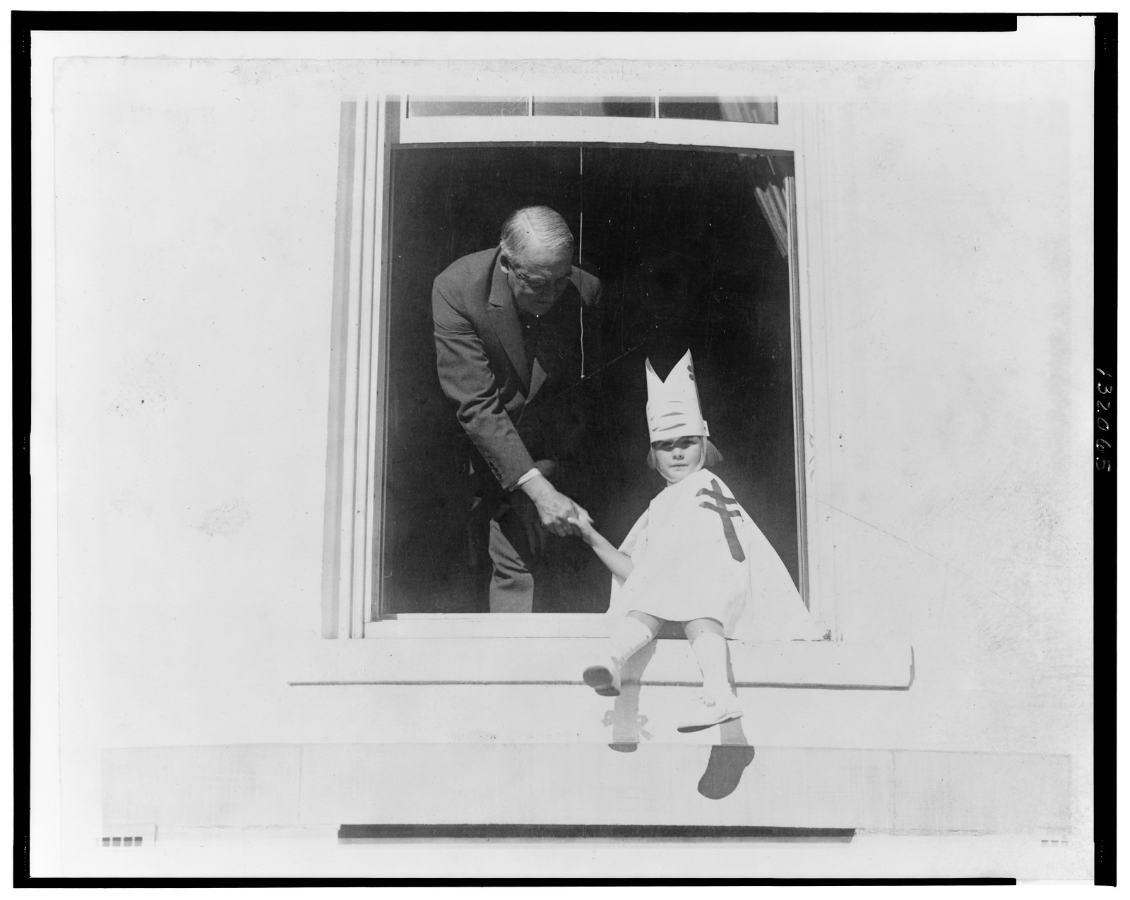 Purchasing Christmas seals from little Sally Lefevre, [1923] — historic photograph